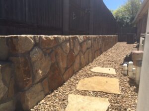 Rock wall and landscape in Bedford Texas