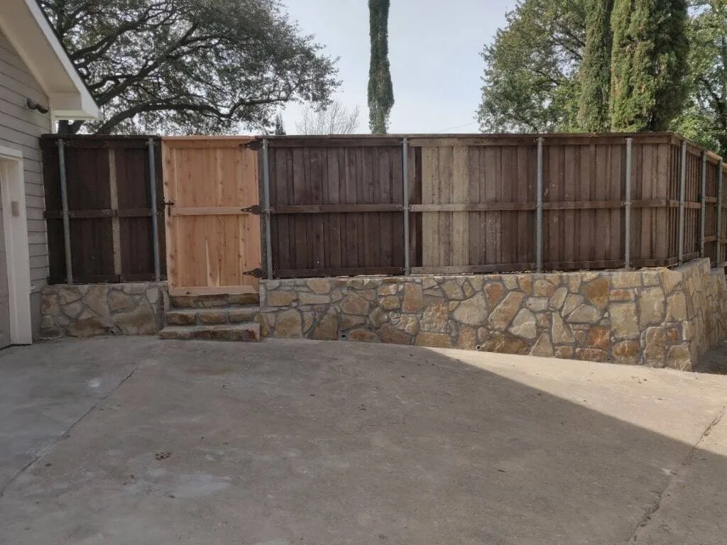 Granbury Stone Retaining Wall with Steps | Dallas TX Dallas retaining wall replaced cross ties with Milsap stone