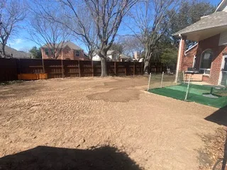 Finished pool removal in Plano TX — backfilled, graded, and compacted yard ready for use after complete swimming pool demolition