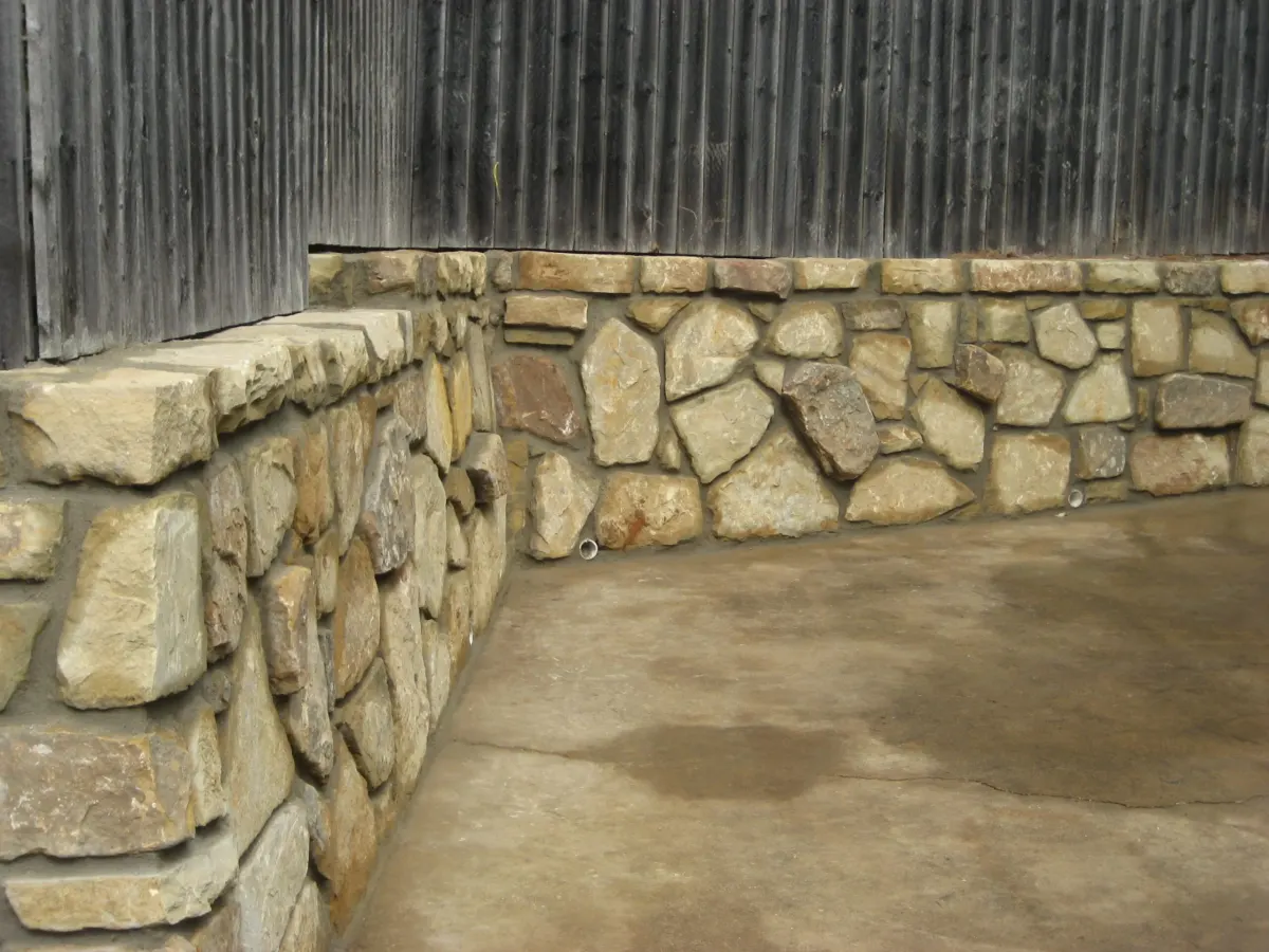 Natural stone retaining wall corner in Colleyville, TX Natural stone retaining wall corner in Colleyville, TX