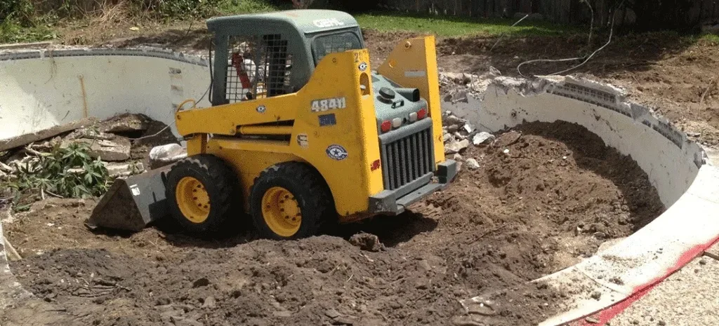 Skid steer backfilling pool removal in Colleyville, TX Skid steer backfilling pool removal in Colleyville, TX