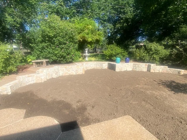 Restored grade meeting the existing patio — Flower Mound TX Backfilled and graded Flower Mound back yard meeting an existing aggregate patio