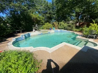 Swimming pool before removal — Flower Mound TX Existing swimming pool and aggregate patio in a Flower Mound back yard before removal
