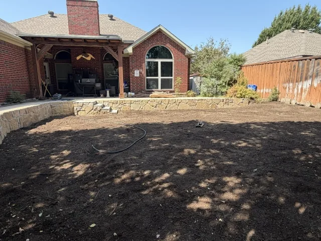 Open level back yard in Lewisville Texas after swimming pool demolition and grading