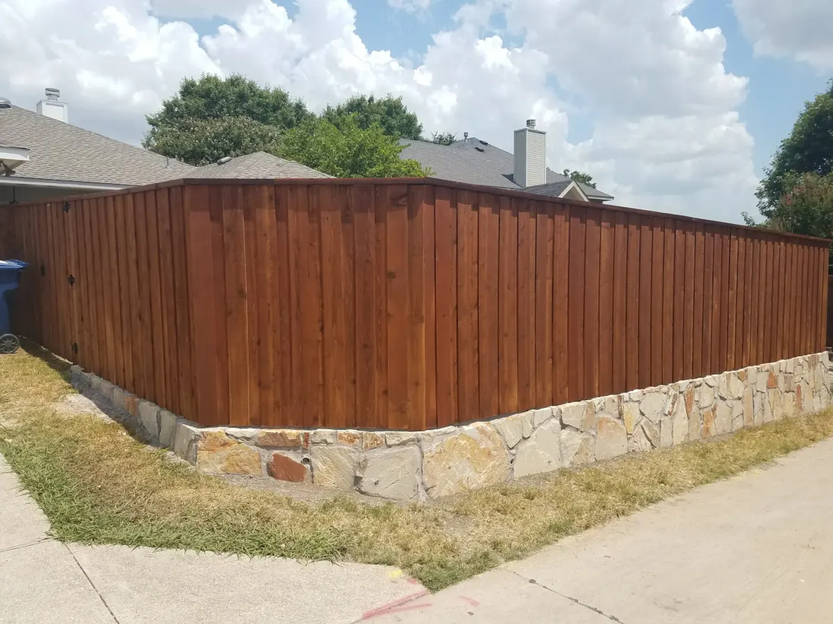 Stone retaining wall fence base — a JCL Landscape Services project in the Dallas–Fort Worth metroplex