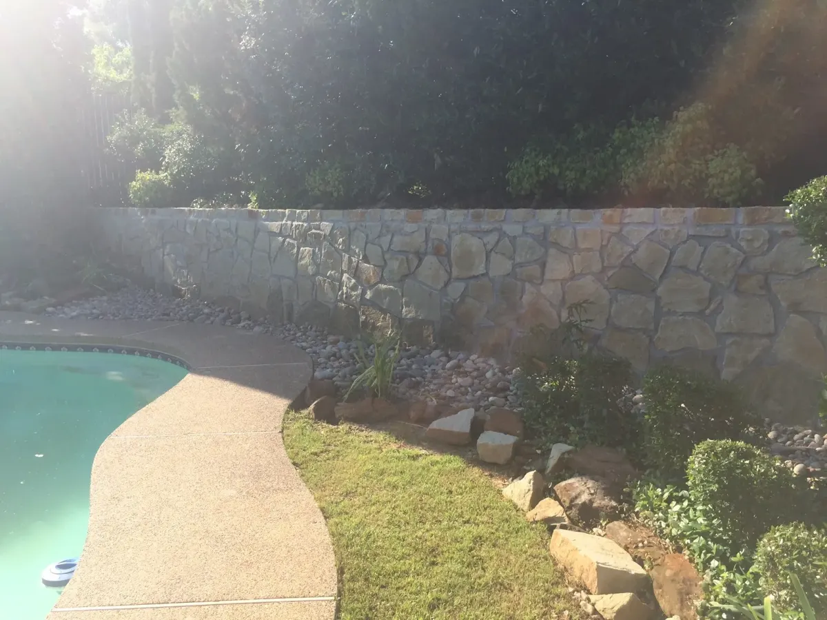 Stone retaining wall pool drainage — a JCL Landscape Services project in the Dallas–Fort Worth metroplex Stone retaining wall pool drainage — a JCL Landscape Services project in the Dallas–Fort Worth metroplex