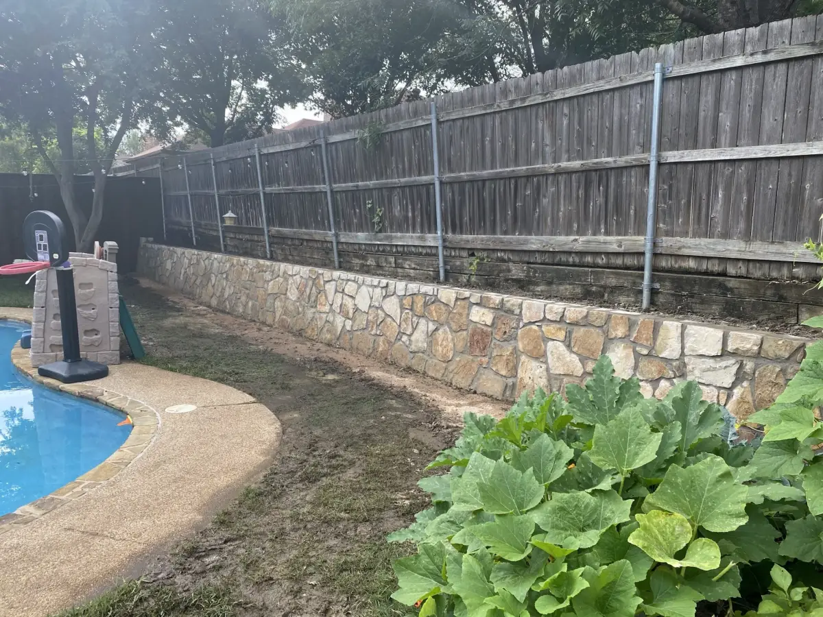 Stone retaining wall replacement pool — a JCL Landscape Services project in the Dallas–Fort Worth metroplex