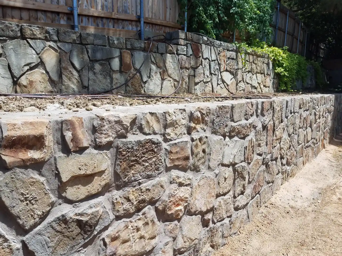 Tiered granbury stone retaining wall rebuild — a JCL Landscape Services project in the Dallas–Fort Worth metroplex Tiered granbury stone retaining wall rebuild — a JCL Landscape Services project in the Dallas–Fort Worth metroplex